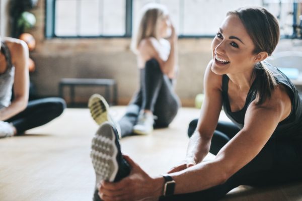 A woman teaching streching methods 